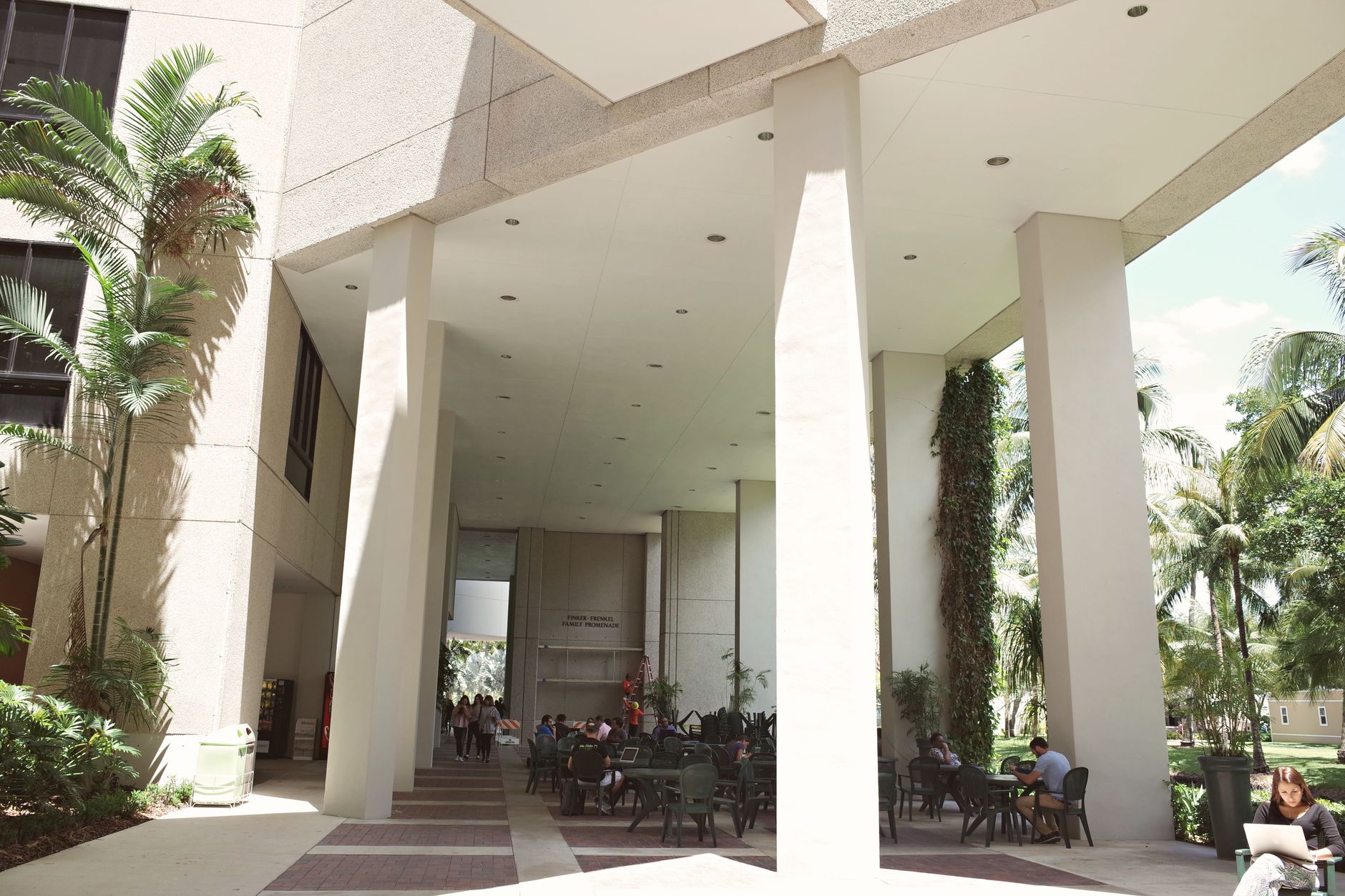A busy university student union corridor represents the high traffic floors custodial teams must keep presentable for students and visitors.