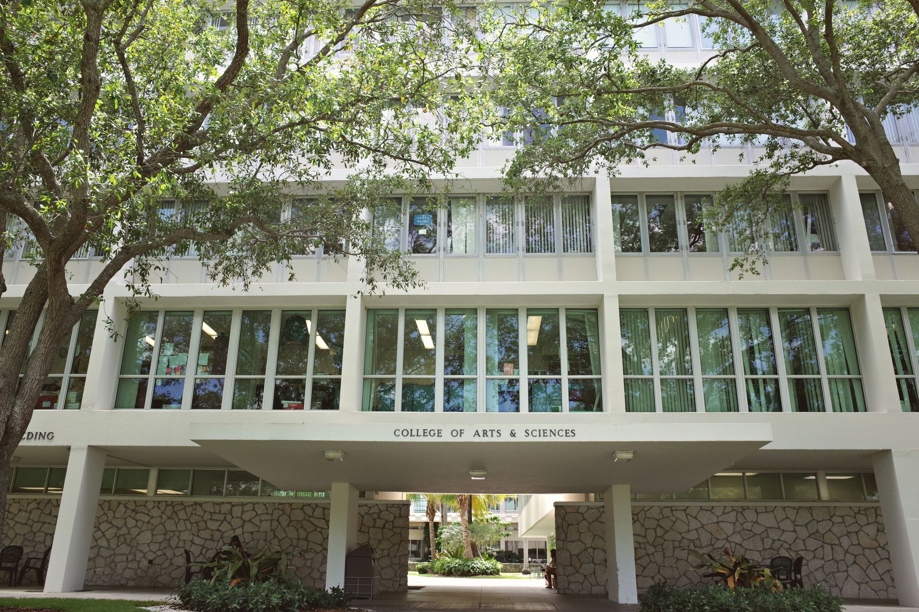 Modern campus interior with glass and open corridors like the research and health sciences facilities in the case study.