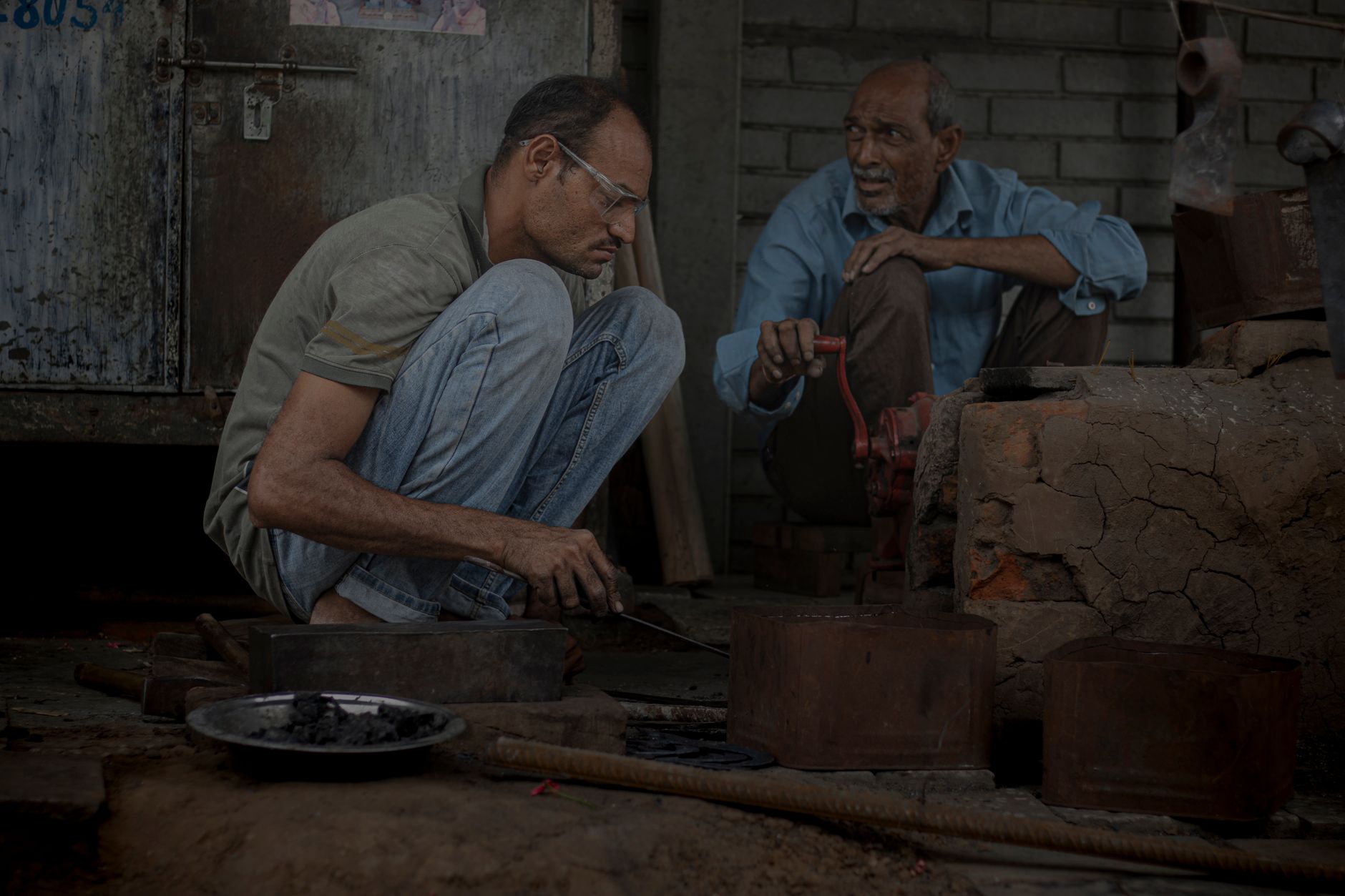 A technician works with tools at a manufacturing workbench, reflecting the plant’s internal integration capability.