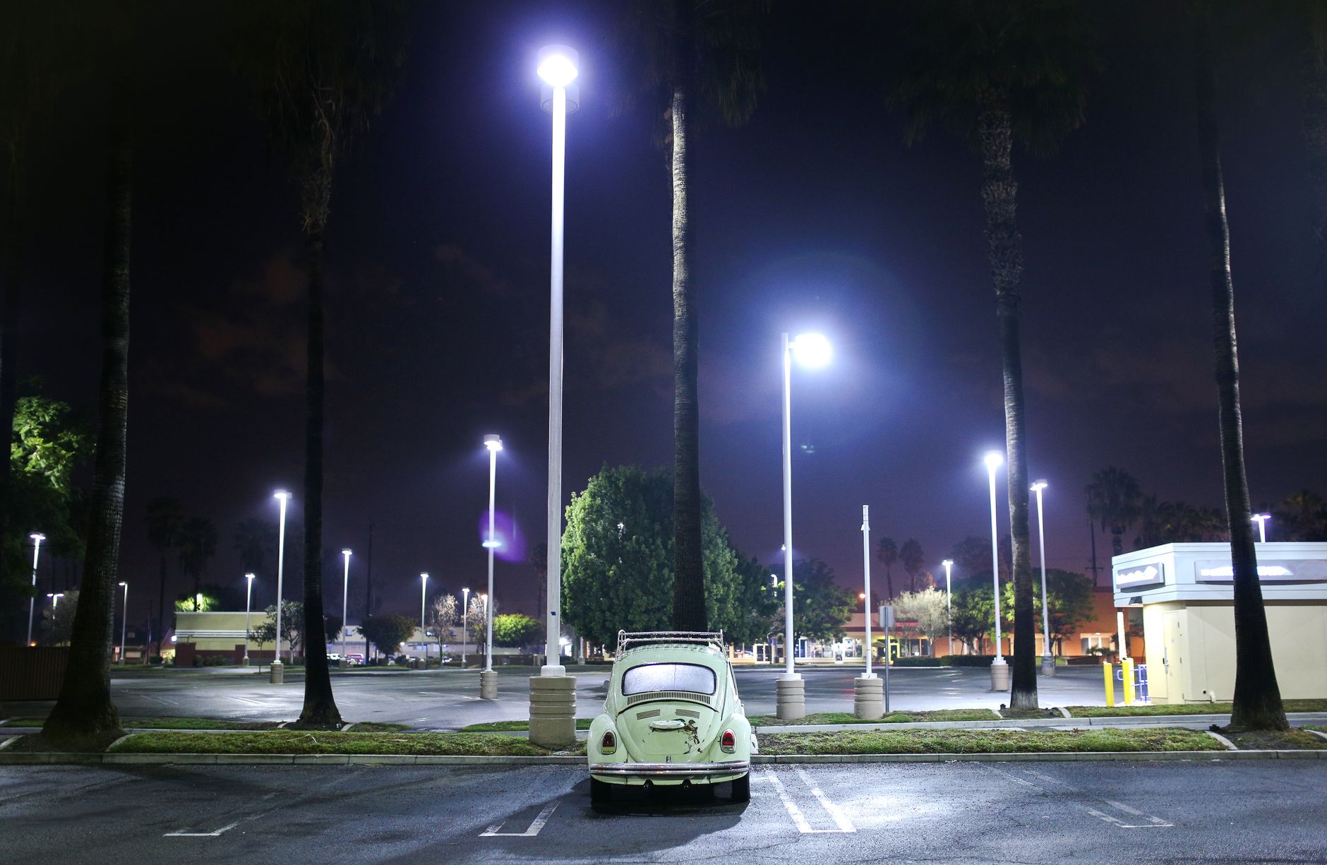 Tall light poles overlooking a wide outdoor vehicle lot where patrol units were mounted.