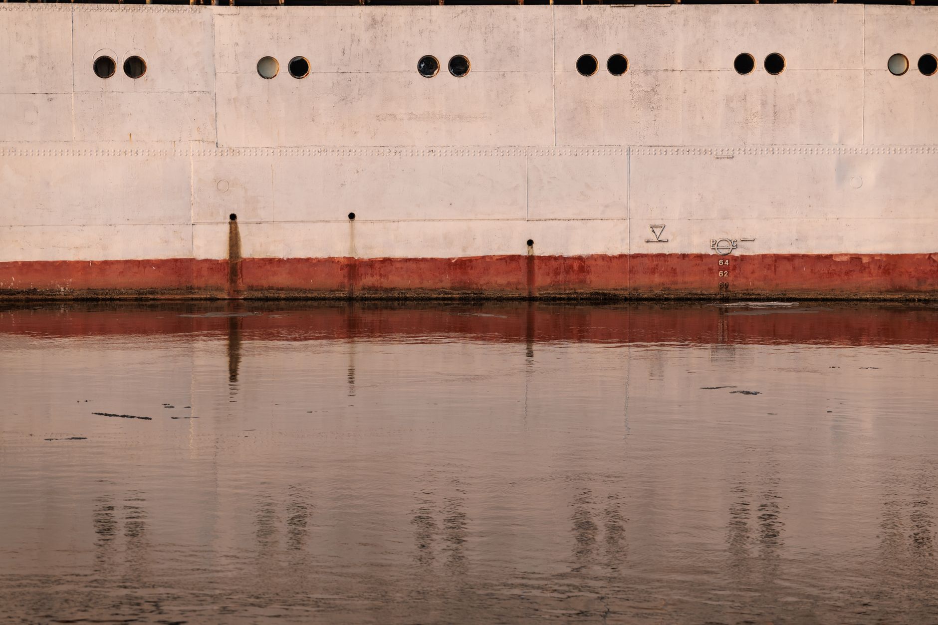Metal tank surfaces inside a large vessel where confined visual surveys are required.