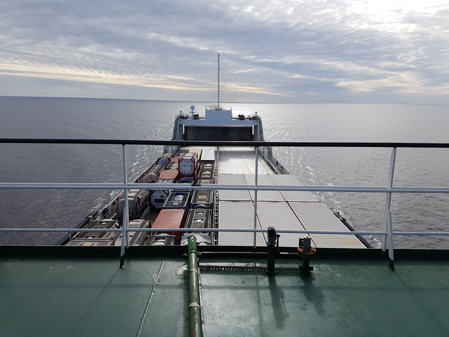 A replenishment-style vessel at port like the ship whose cargo tanks were surveyed.