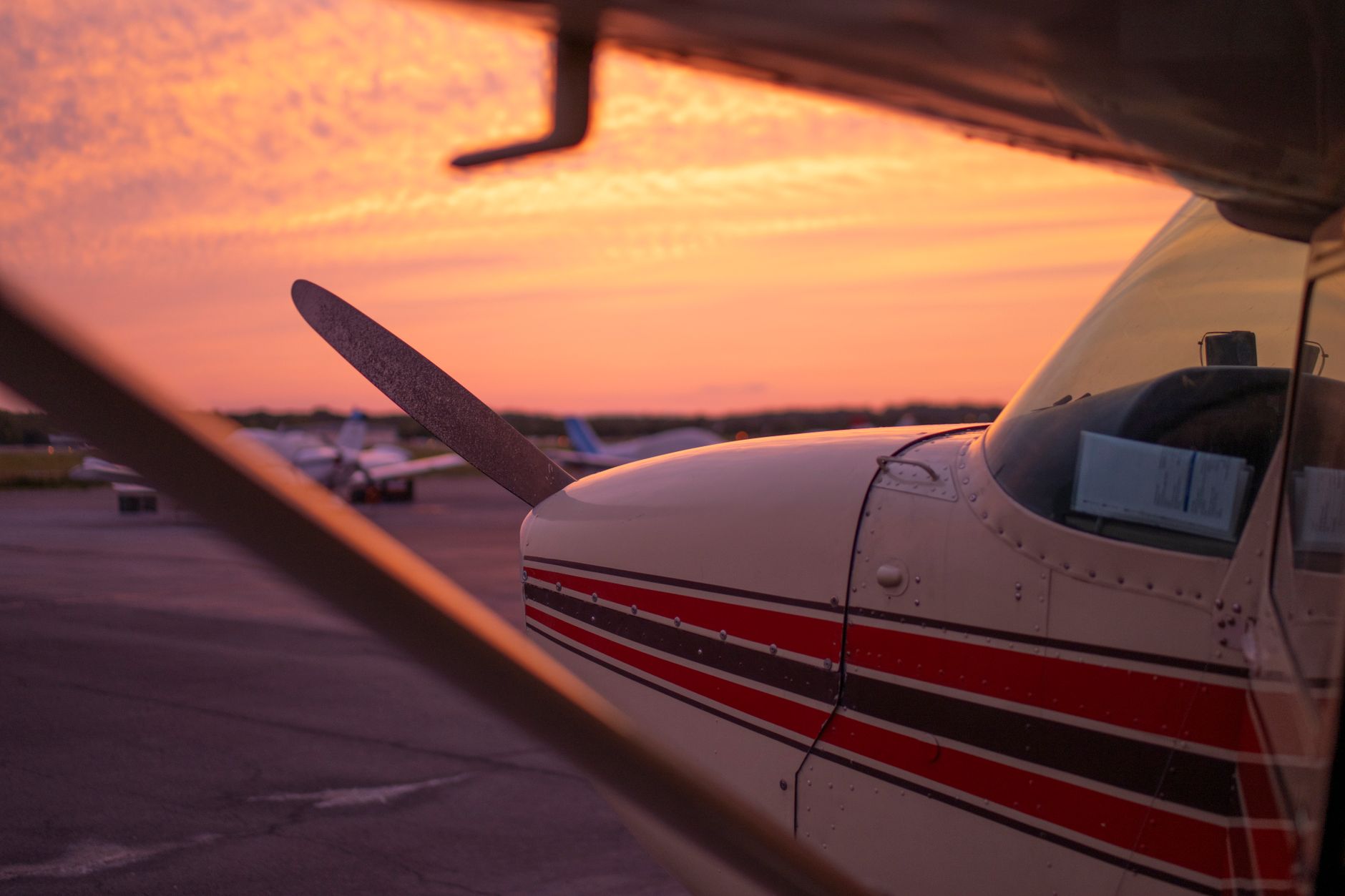 A transport aircraft on the flight line at dusk, echoing faster inspections that return jets to service sooner.