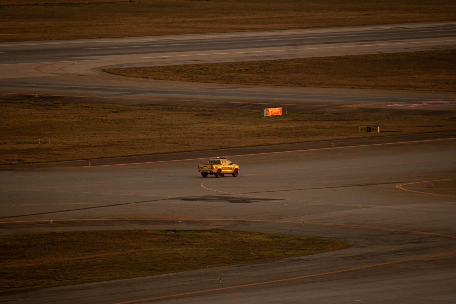 An aerial view of airport runways and taxiways shows the complex operating environment of an active airfield.