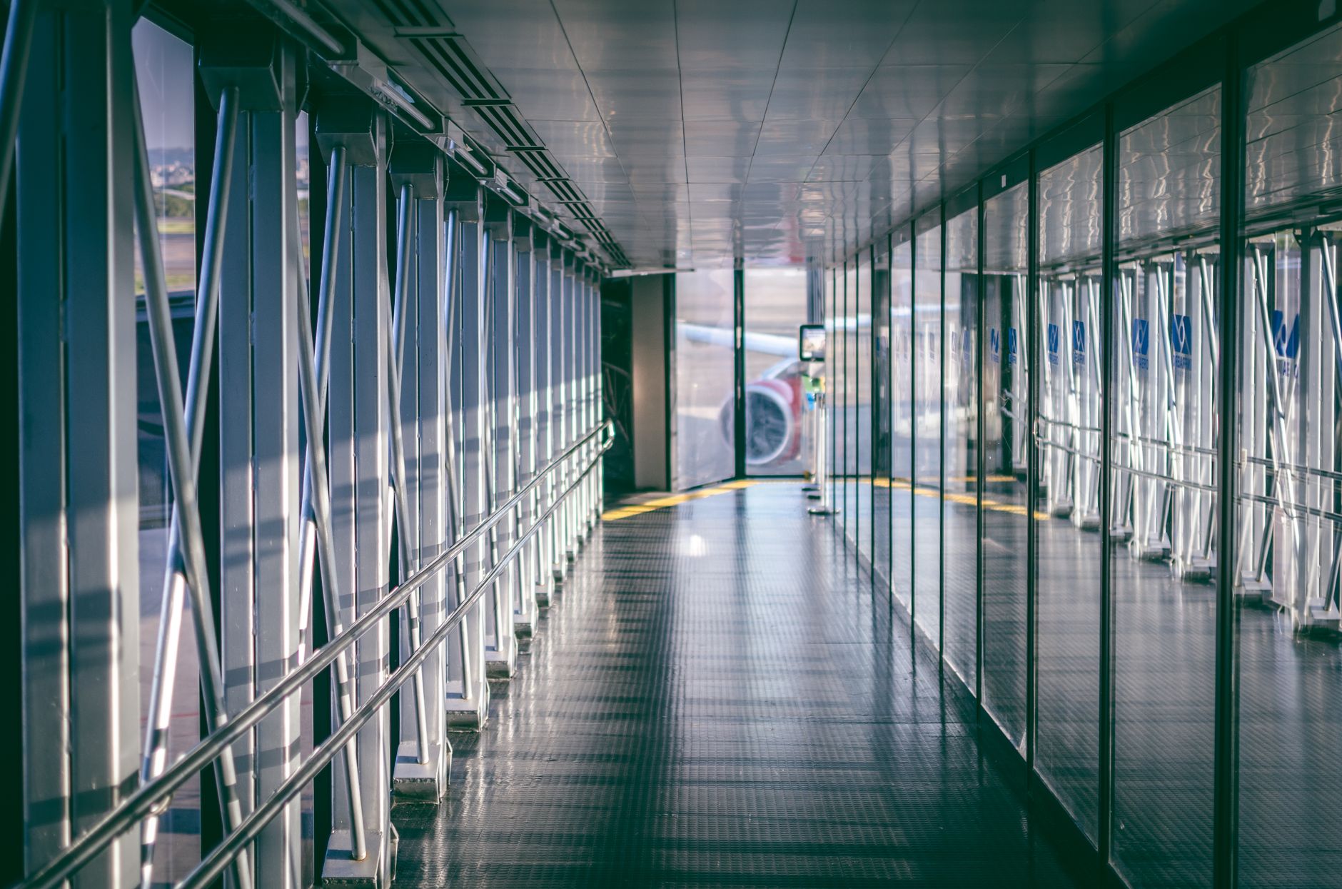 Long airport terminal corridor with broad open flooring that matches the kind of repetitive scrubber route described in the case.
