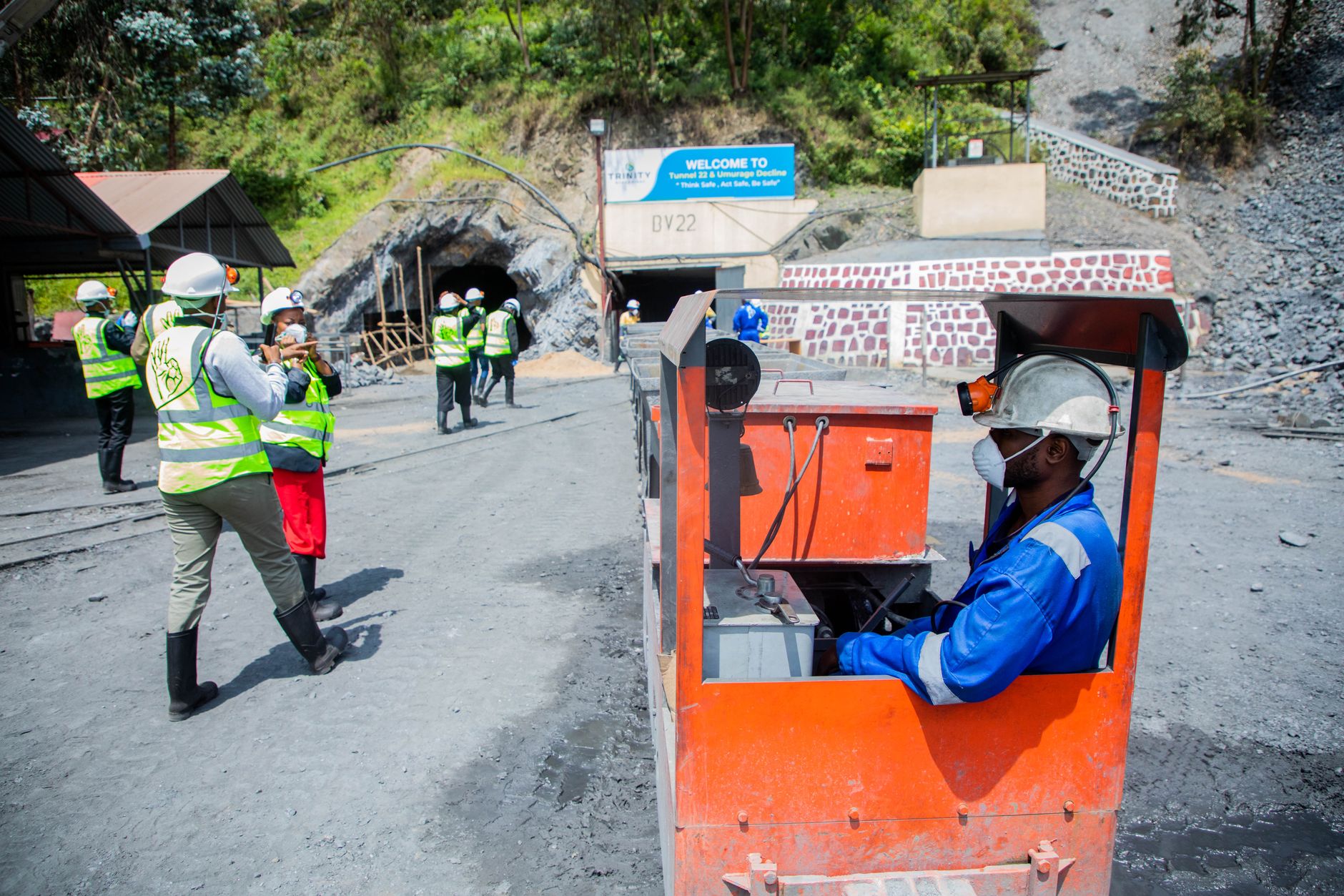 A mining crew reviewing safety and deployment plans before beginning underground work.