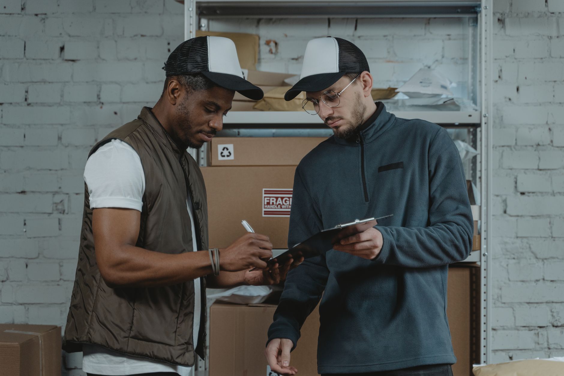 An apparel fulfillment floor where associates pack online orders from fast-moving SKU lines.