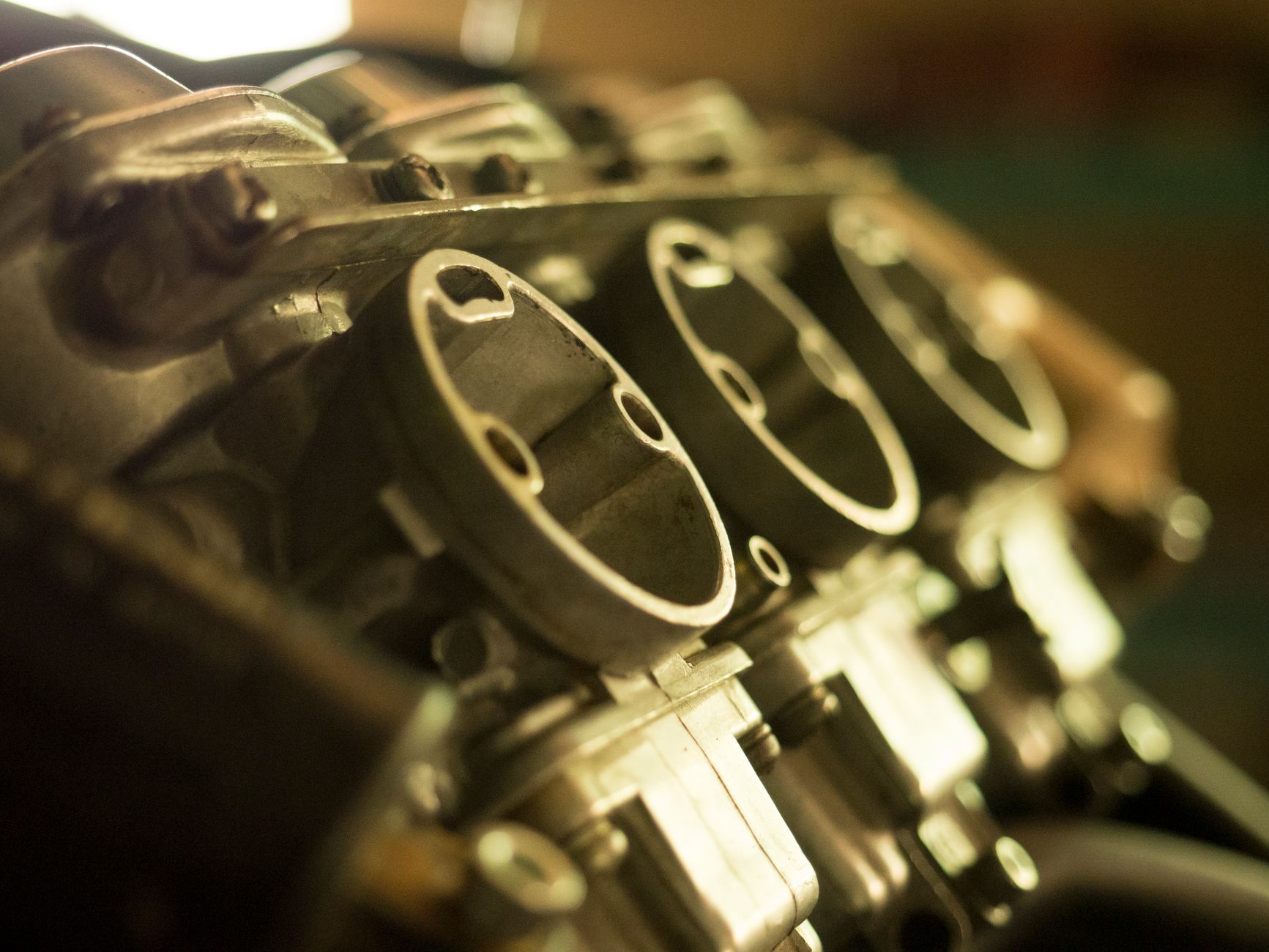 Finished aluminum automotive components arranged for production inspection.