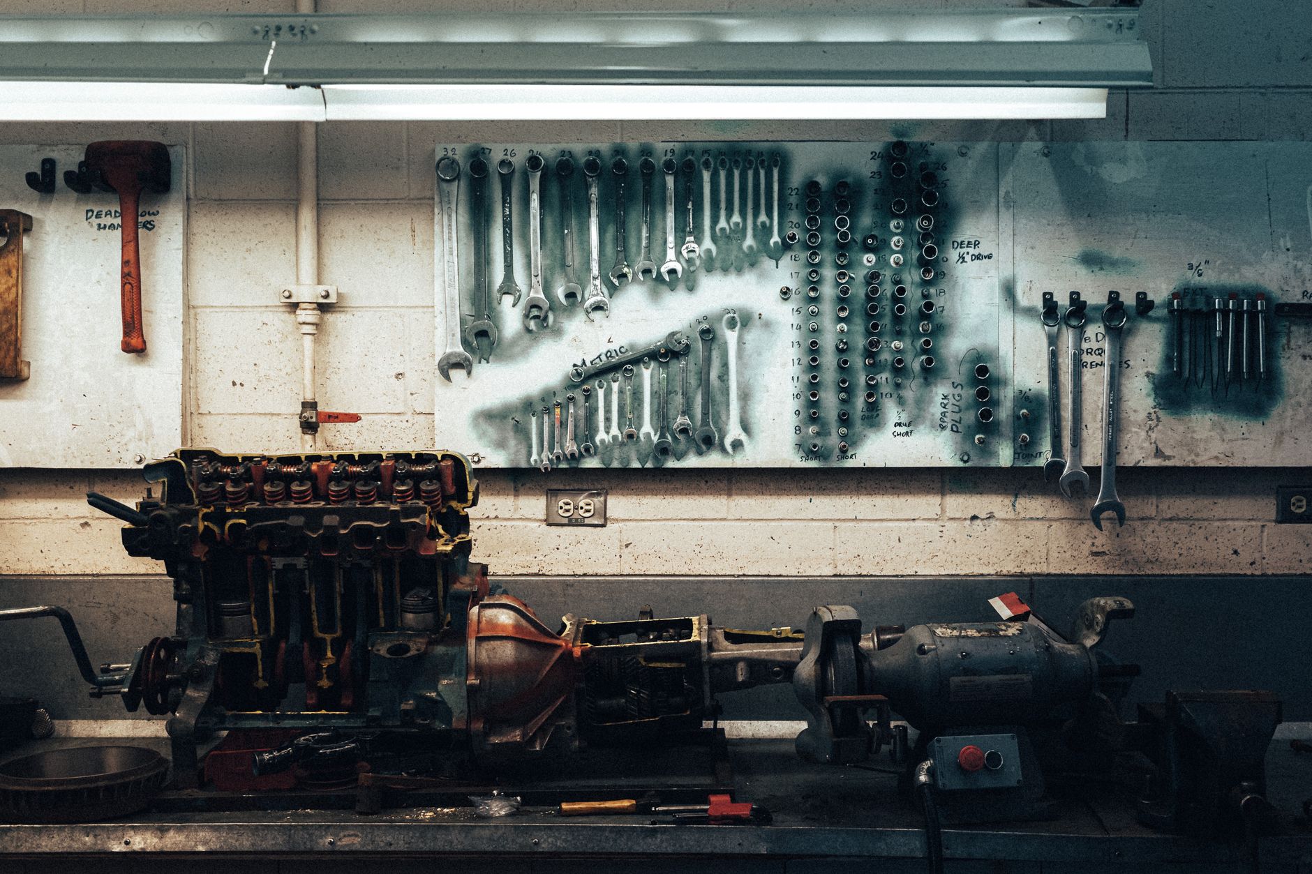Repeatable steel components are arranged on a workbench for welding in a fabrication shop.