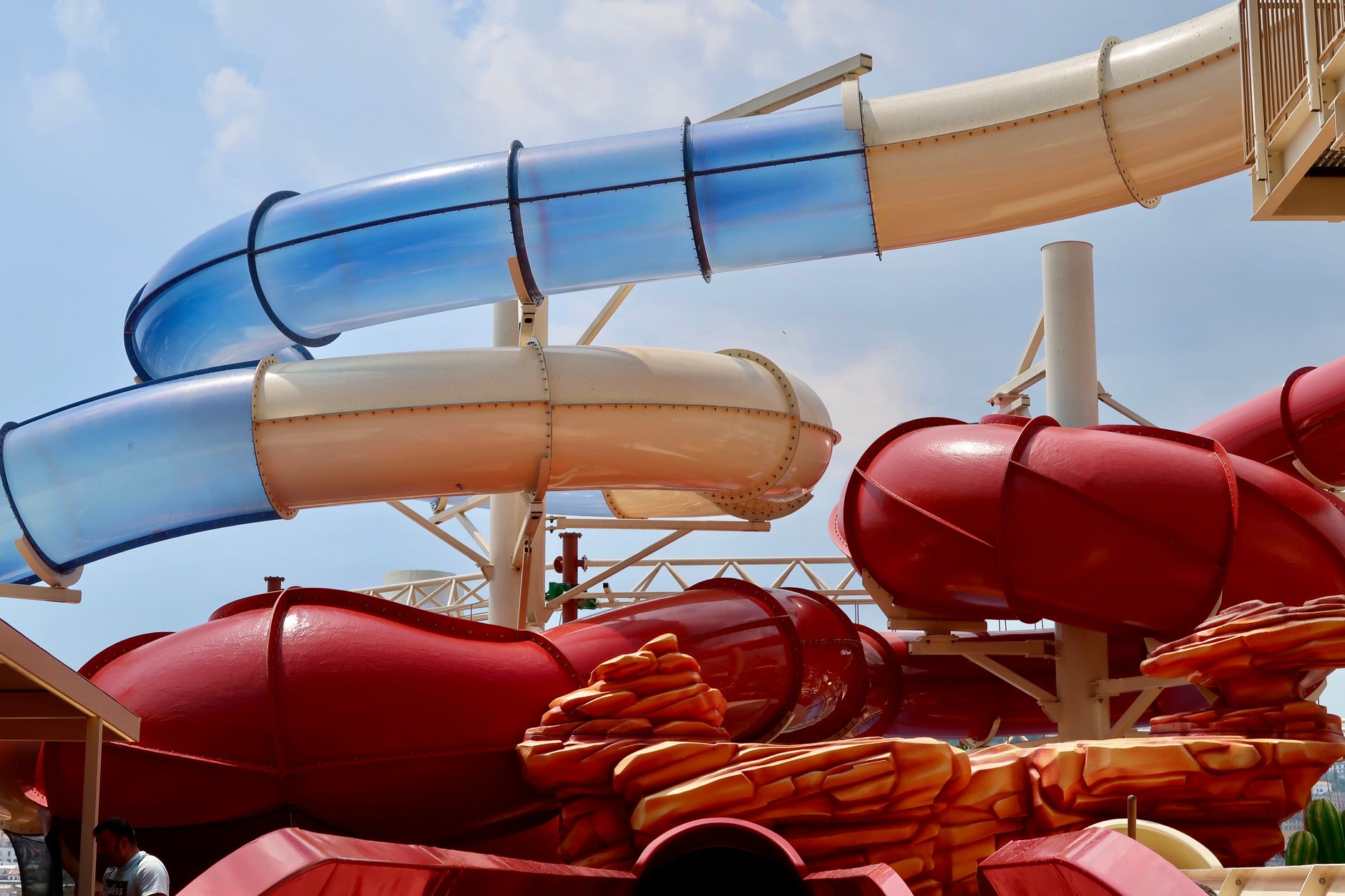 Indoor water ride infrastructure where confined overhead bays are hard to reach with scaffold.