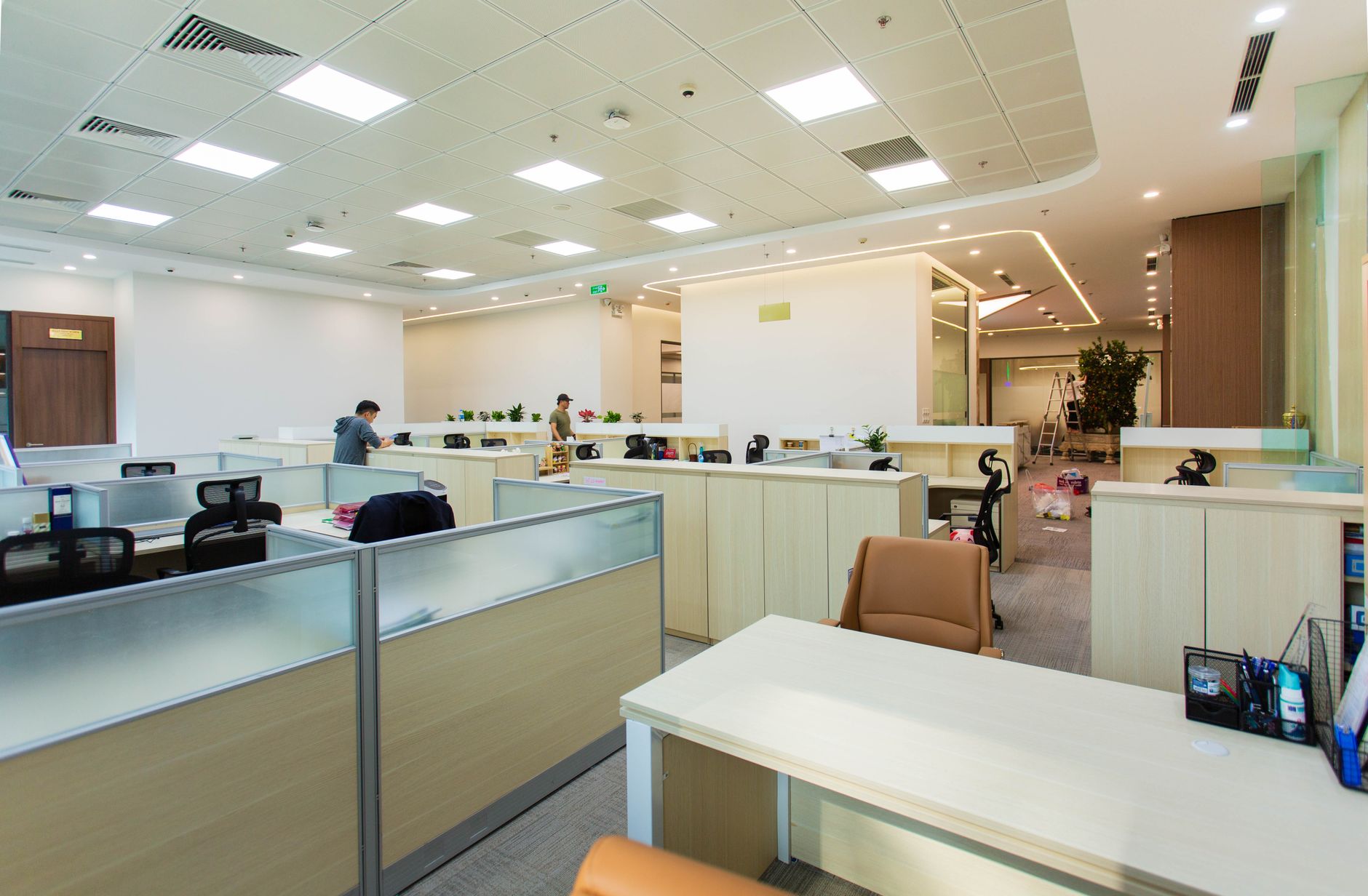 Wide view of a clean open-plan office floor that matches the kind of high-density workplace discussed in the case study.