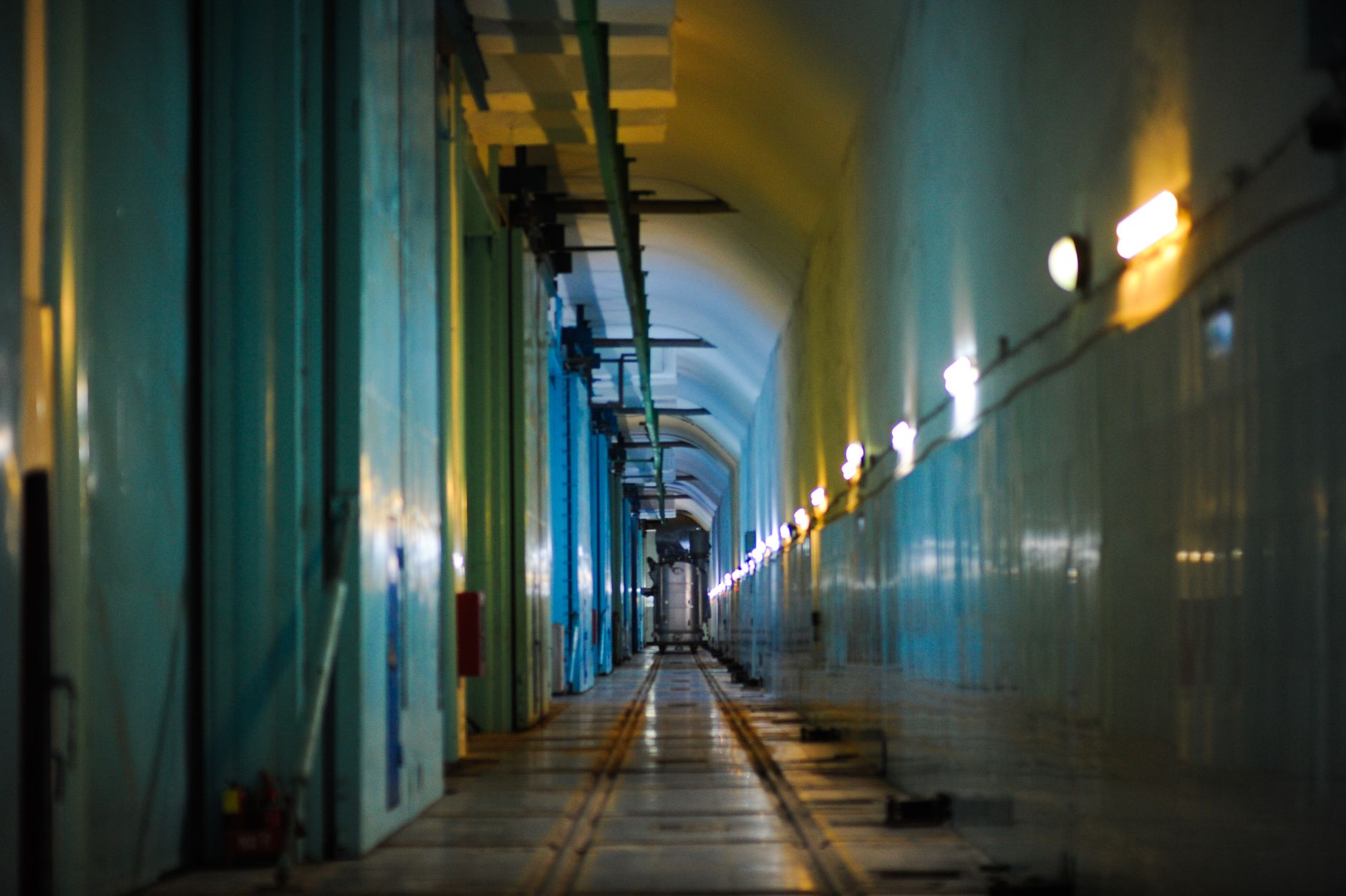 Utility corridor and sump area like the custom wastewater routing that enabled an automated scrubber dock.