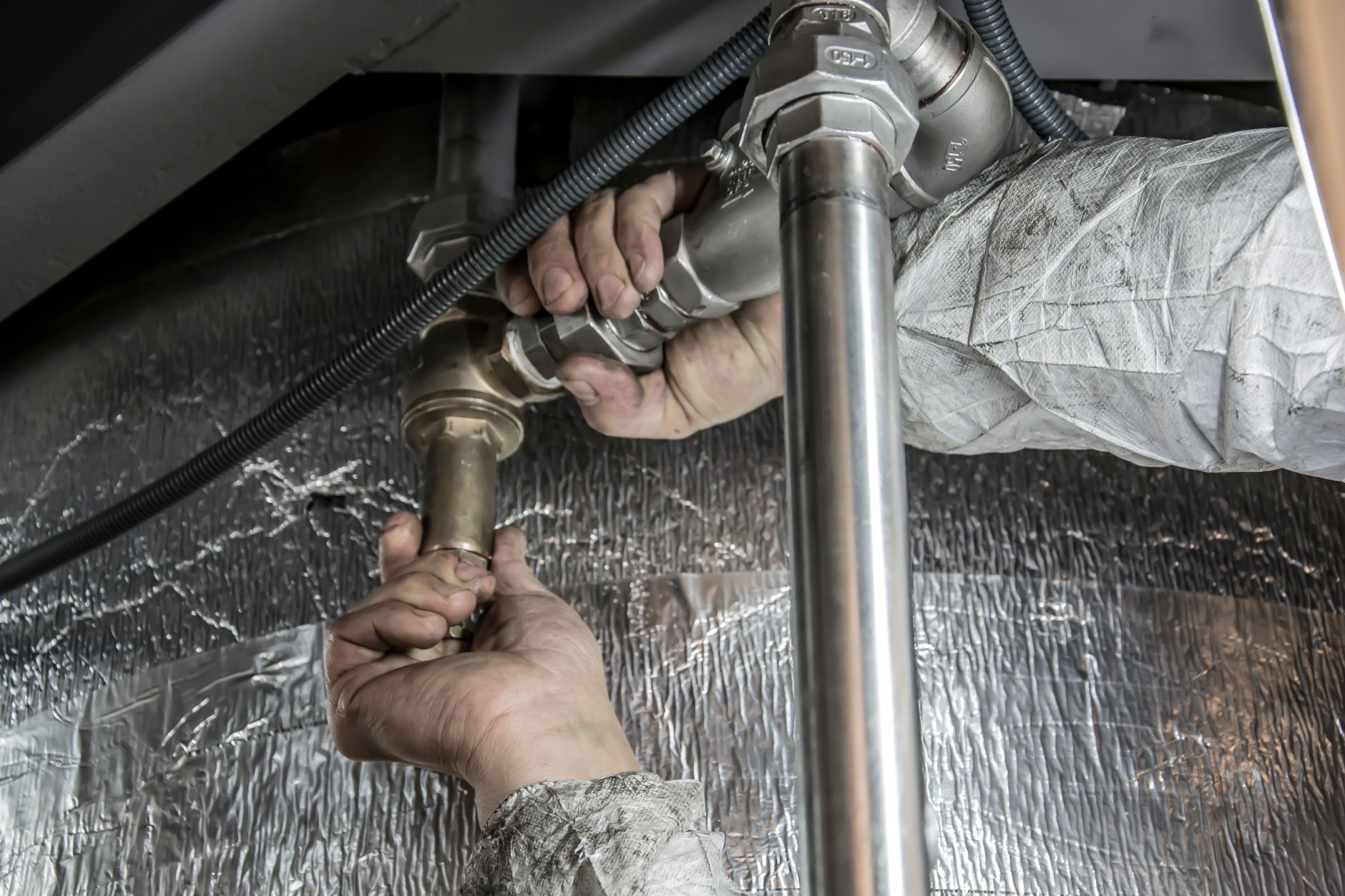 Large mechanical tanks and piping in a service area similar to plumbing contractors who stage underground installs.