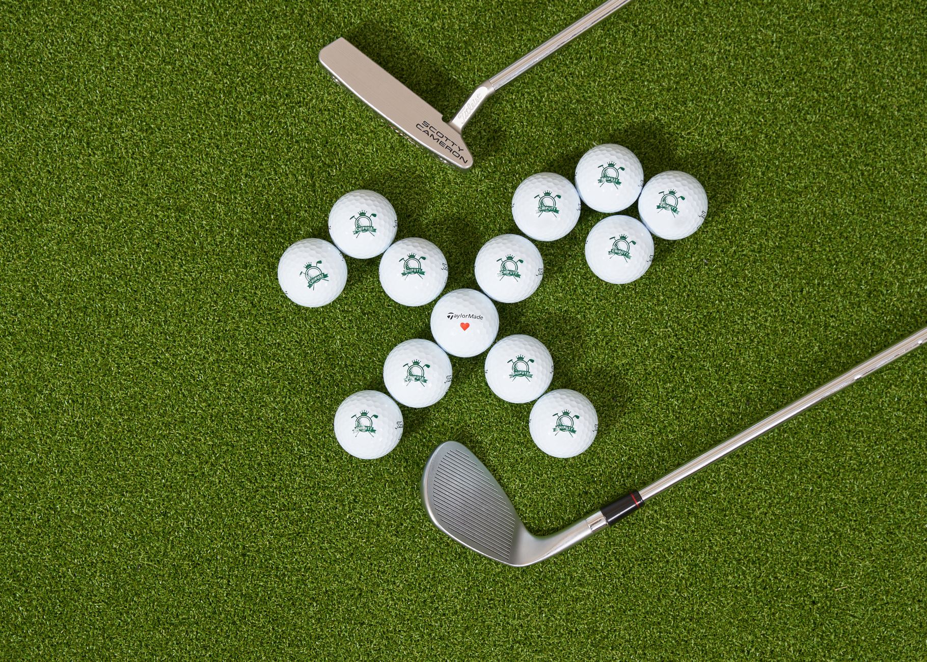 Golf balls with clubs on artificial turf, ideal for training