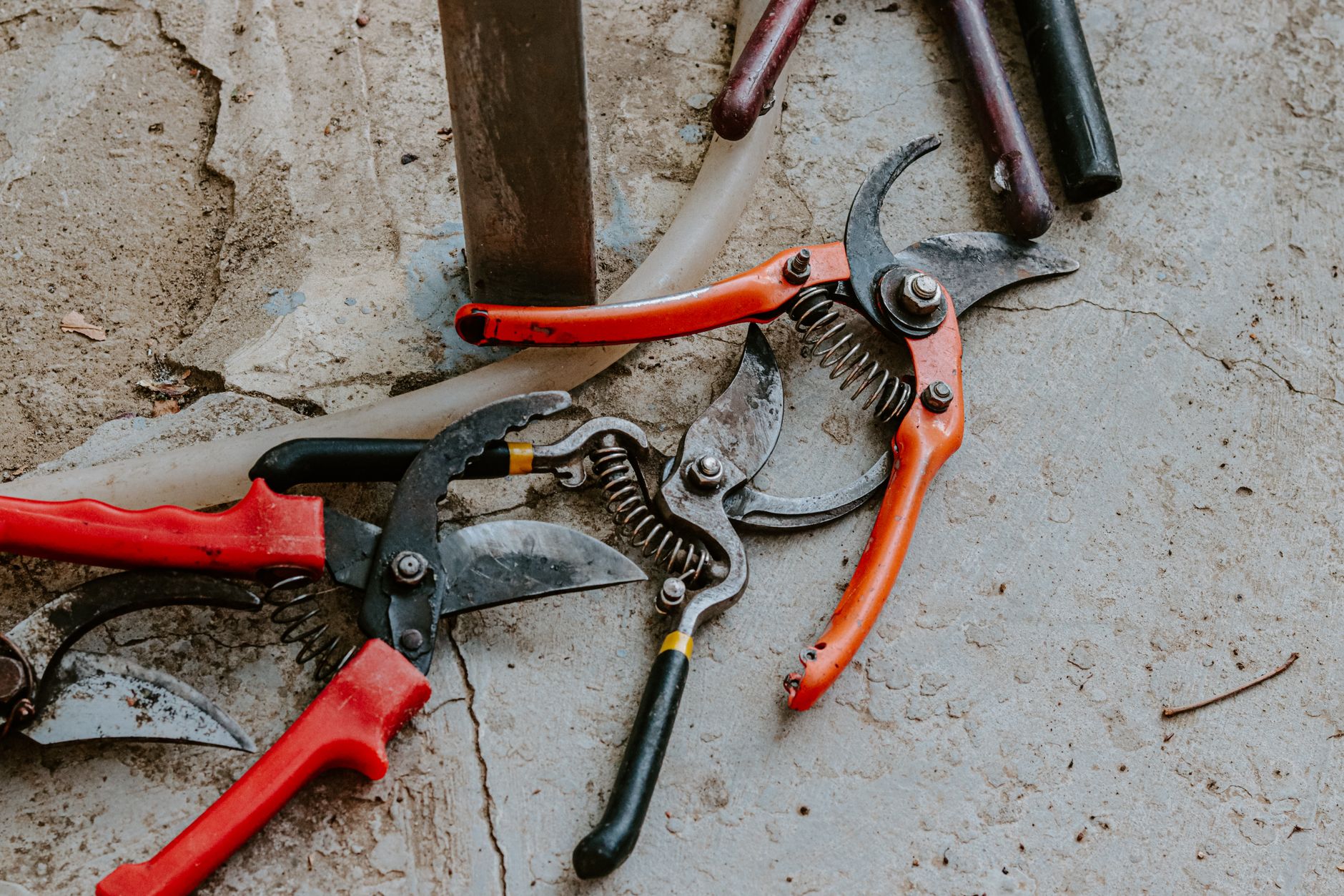 A technician works at a bench with tools and parts in an industrial plant maintenance workshop.