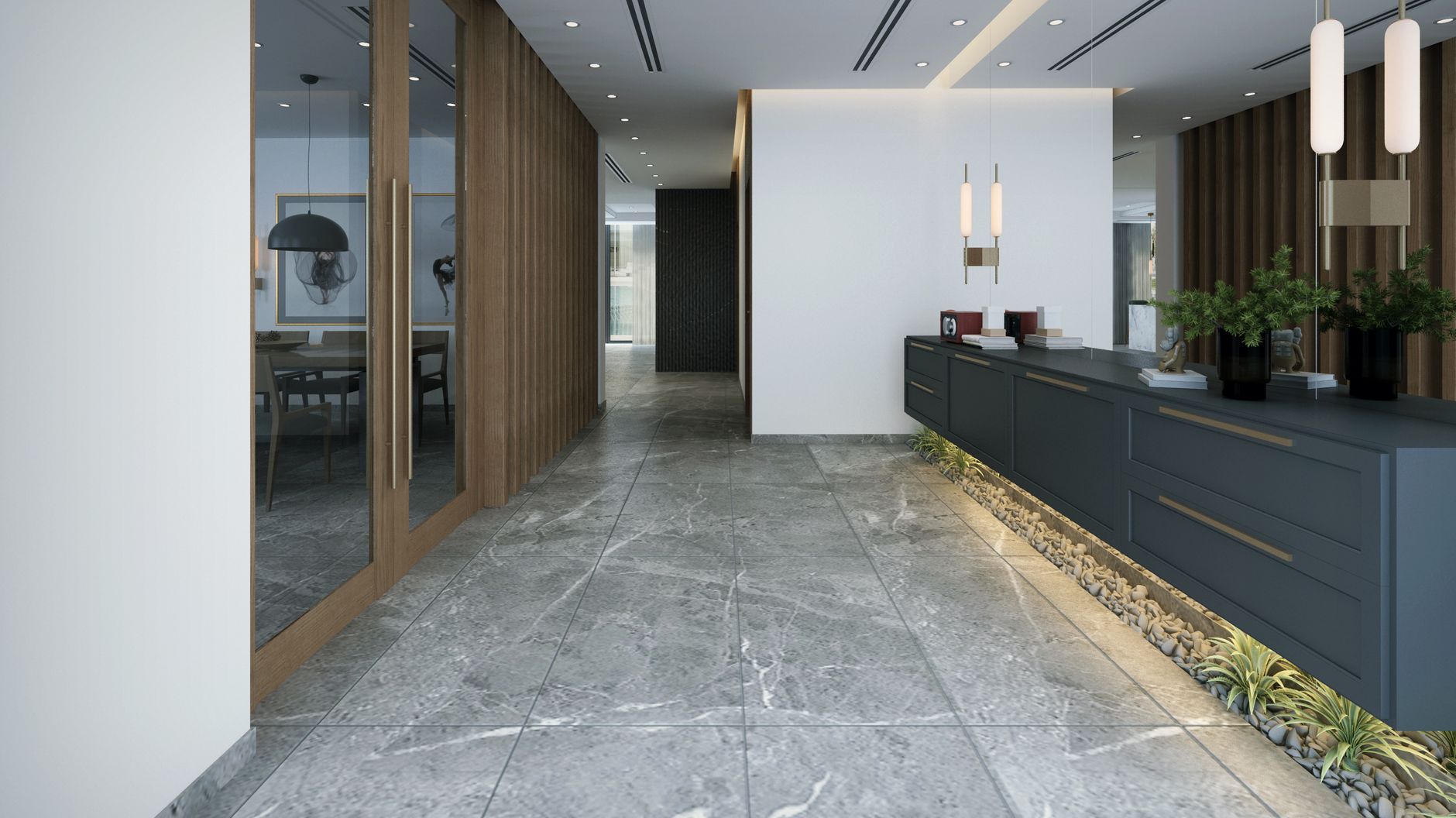 A wide view of a clean office lobby floor with reflective tile and light coming through the entrance.