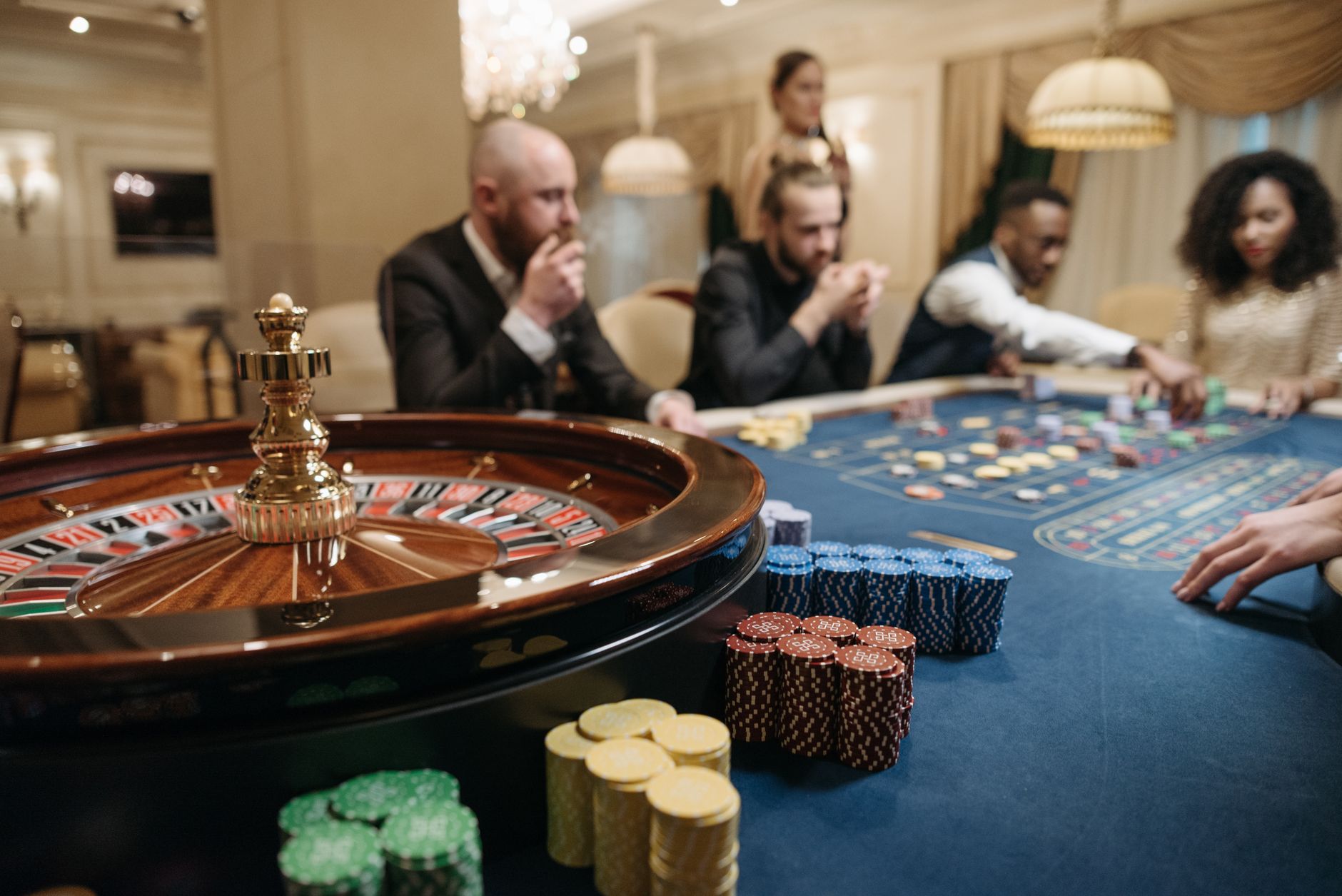 Empty blackjack and roulette tables arranged across a casino floor between shifts.